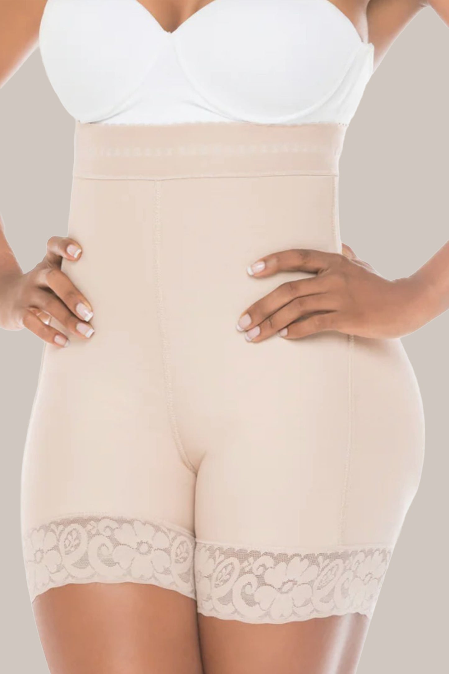 High waist shaping shorts with lace trim worn by a person