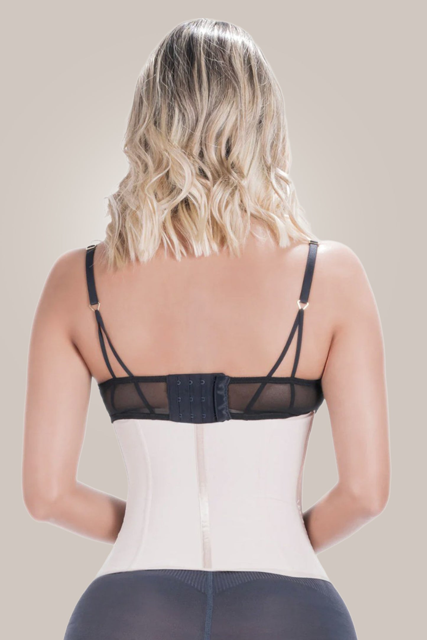 Woman wearing waist- cincher shapewear - back