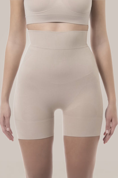 High waist shorts worn by a person on a plain background