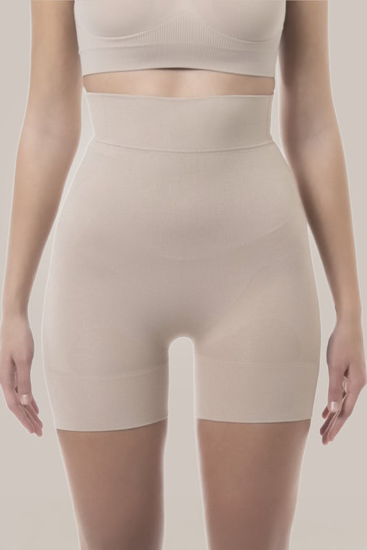 High waist shorts worn by a person on a plain background