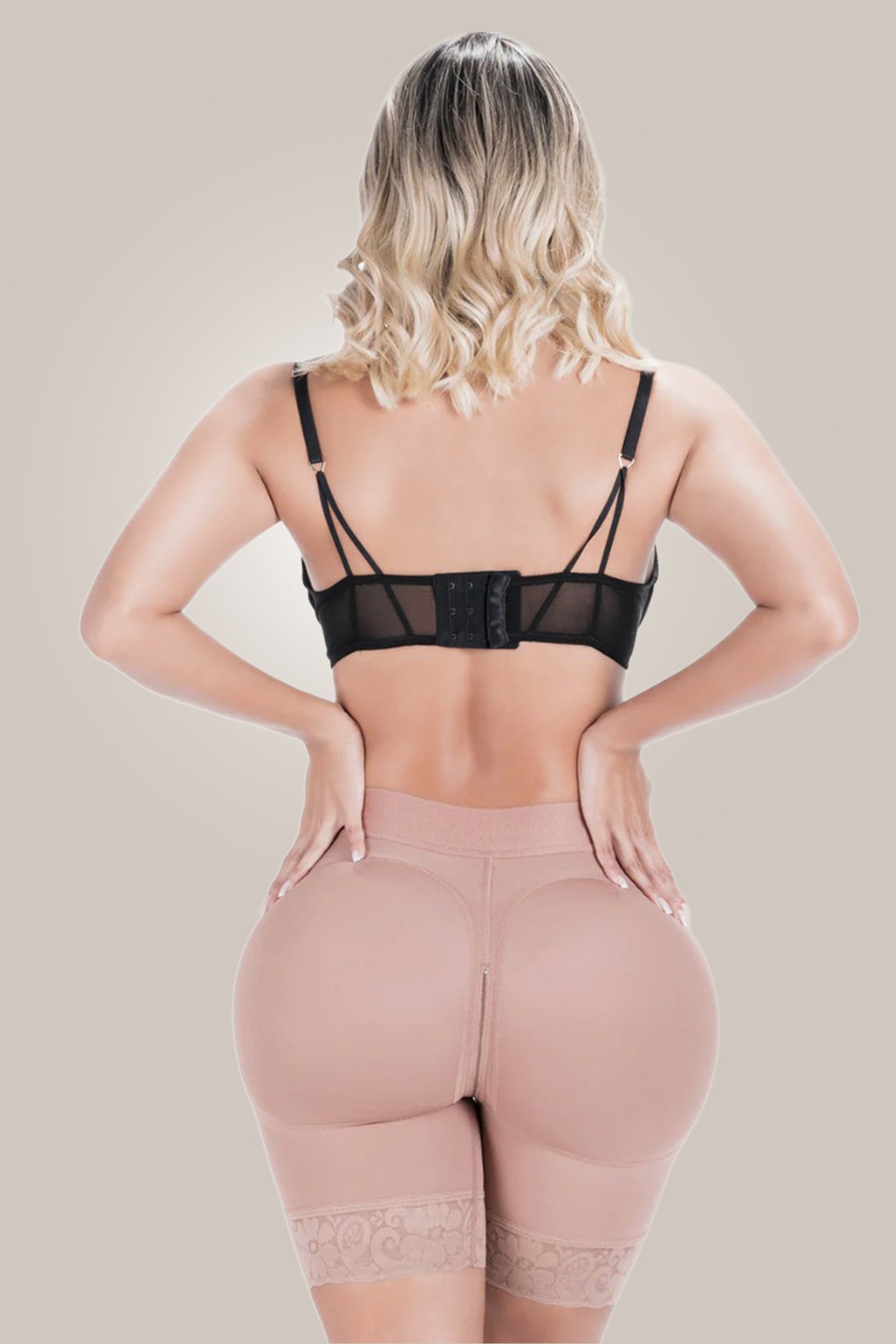 Woman wearing butt shaping shorts - back